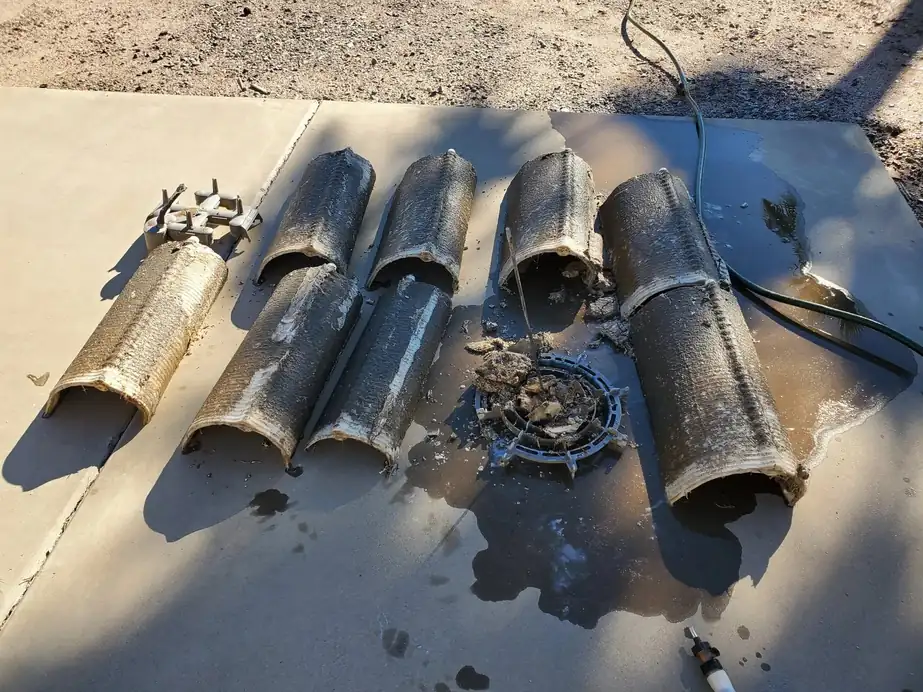 Cartridge filters laid out on the equipment pad partway through a clean